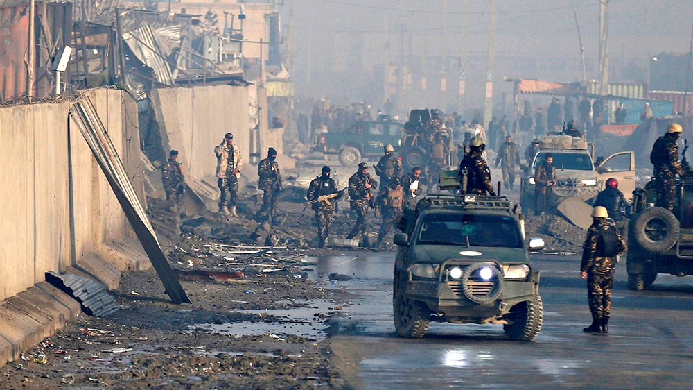 Afghan security forces inspect the site of a car bomb blast in Kabul, Afghanistan January 15, 2019.   REUTERS/Mohammad Ismail