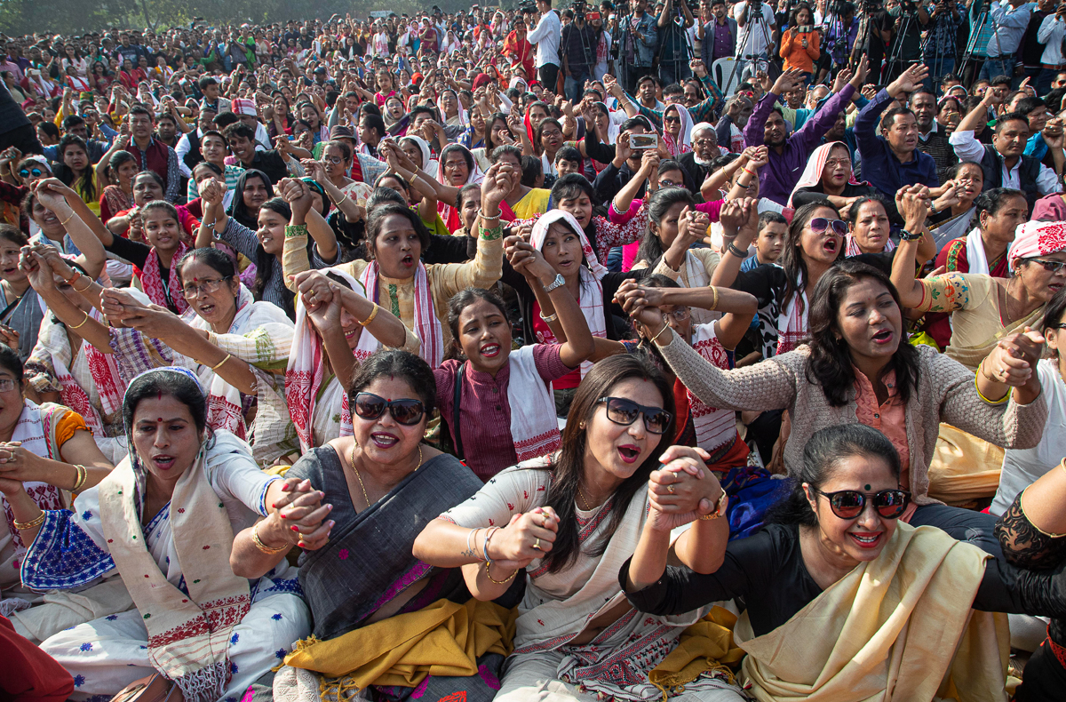 Indians hold hands and shout slogans during a protest against the Citizenship Act in Gauhati, India, Thursday, Dec. 19, 2019. Police detained several hundred protesters in some of India''s biggest citi