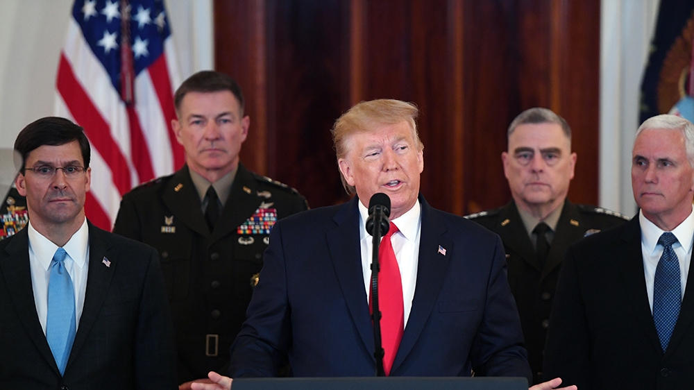 US President Donald Trump(C) speaks about the situation with Iran in the Grand Foyer of the White House in Washington, DC, January 8, 2020. (Photo by SAUL LOEB / AFP)