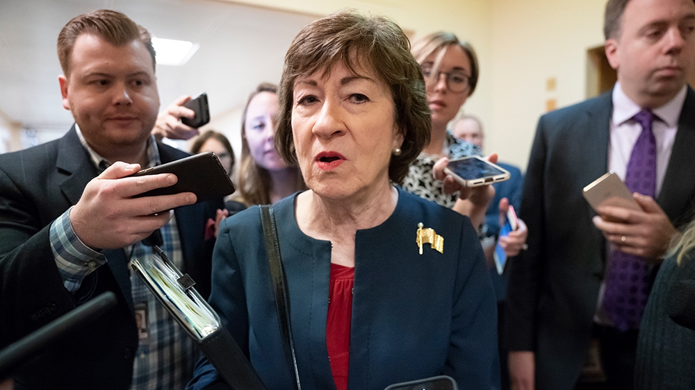 Sen. Susan Collins, R-Maine, is surrounded by reporters as she rushes to a vote at the Capitol in Washington, Wednesday, Nov. 6, 2019.  (AP Photo/J. Scott Applewhite)