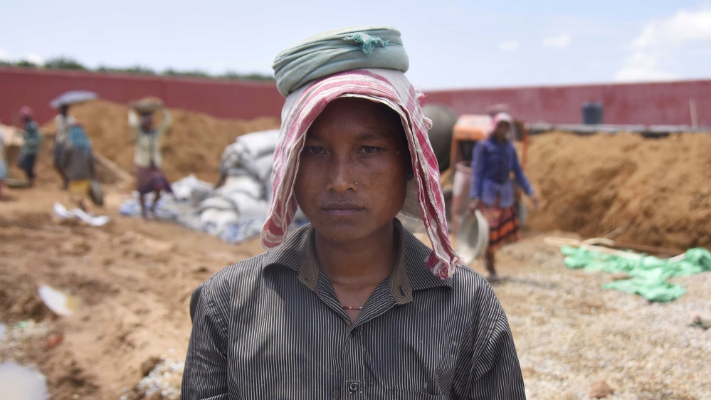 Shefali Hajong, a labourer whose name is excluded from the final list of the National Register of Citizens (NRC), poses for a picture at the site of an under-construction detention centre for illegal