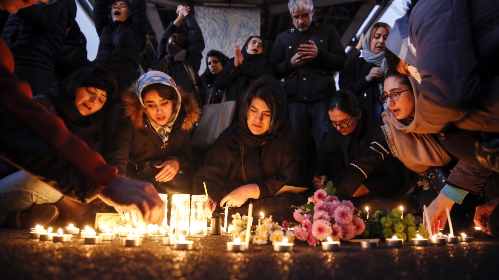Iranians light candles for victims of Ukraine International Airlines Boeing 737-800 during as they protest in front of the Amir Kabir University in Tehran, Iran, 11 January 2020. Media reported that h