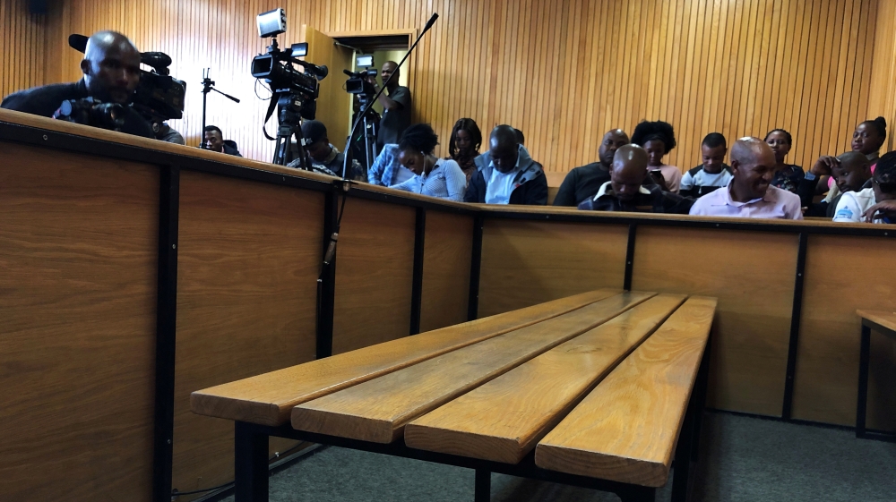 The dock sits empty as people await the arrival of Lesotho''s Prime Minister Thomas Thabane in court in Maseru