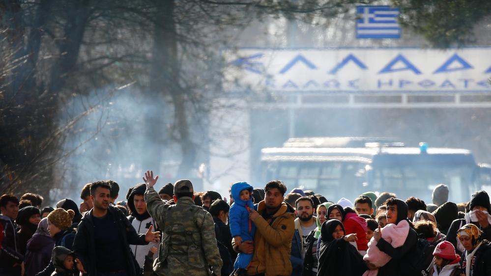 Group of migrants waiting on no man's land between Turkey and Greece, at the Turkeys Pazarkule border crossing with Greece's Kastanies