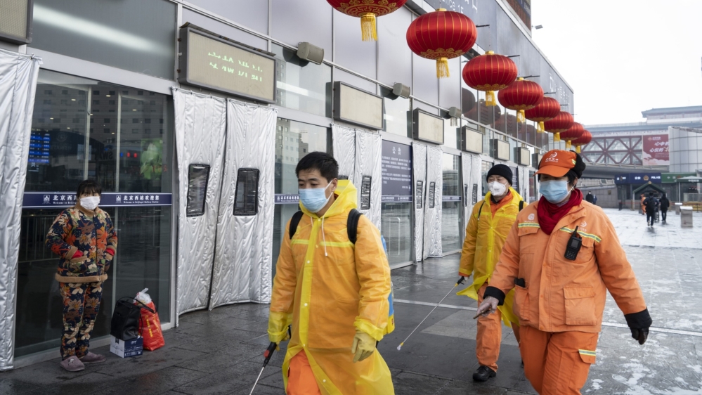 Workers at train station in Beijing