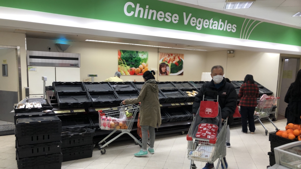 Empty Chinese vegetable shelves in Hong Kong supermarket