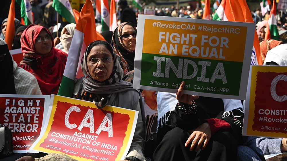 Protesters from Shaheen Bagh hold placards as they take part in a demonstration against India''s new citizenship law at Jantar Mantar, in New Delhi on January, 29, 2020. (Photo by Sajjad HUSSAIN / AFP)