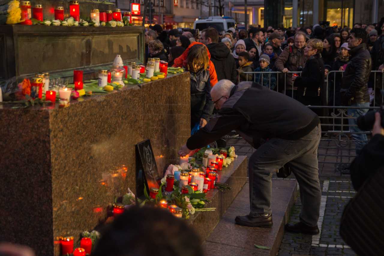 Mourners placed candles during the vigil to commemorate the victims of the attack in central Hanau