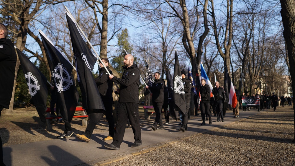 Budapest - marchers with white supremacist celtic cross flags