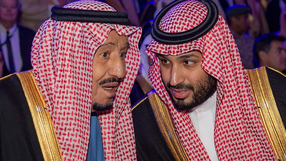 A handout picture provided by the Saudi Royal Palace shows Saudi Arabia''s King Salman bin Abdulaziz (L) talking to Crown Prince Mohammed bin Salman during an event to lay the cornerstone of the Diriya