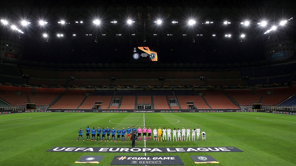 Soccer Football - Europa League - Round of 32 Second Leg - Inter Milan v Ludogorets - San Siro, Milan, Italy - February 27, 2020    The teams line up before the match in an empty stadium after fans we