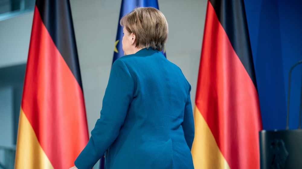 German Chancellor Angela Merkel leaves a media statement on the spread of the new coronavirus disease (COVID-19) at the Chancellery in Berlin