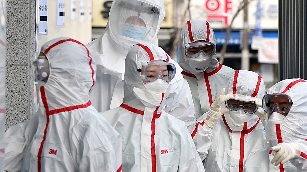 Medical staffs in protective gears arrive for a duty shift at Dongsan Hospital in Daegu, South Korea, Tuesday, March 3, 2020. China''s coronavirus caseload continued to wane Tuesday even as the epidem