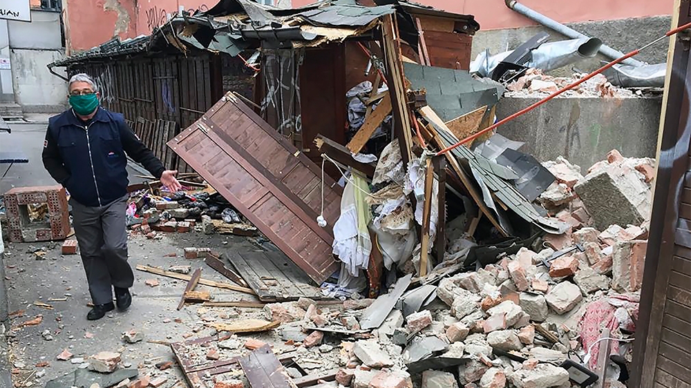 A man inspects the damage caused by an earthquake in Zagreb, Croatia, Sunday, March 22, 2020. A strong earthquake shook Croatia and its capital on Sunday, causing widespread damage and panic. (AP Phot