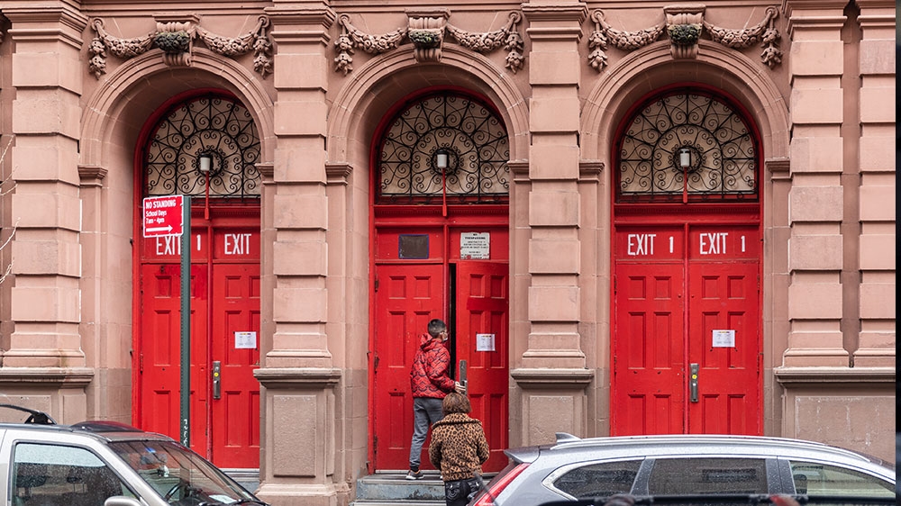 Children enter PS 042 Benjamin Altman school to pick up school-provided takeout lunches, after New York City Mayor Bill de Blasio ordered schools closed due to the coronavirus (COVID-19) outbreak