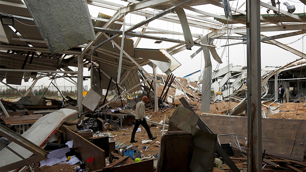 A worker checks the damages at a civilian airport under construction which, according to Iraqi religious authorities, was hit by a U.S. air strike, in the holy Shi'ite city of Kerbala, Iraq March 13, 