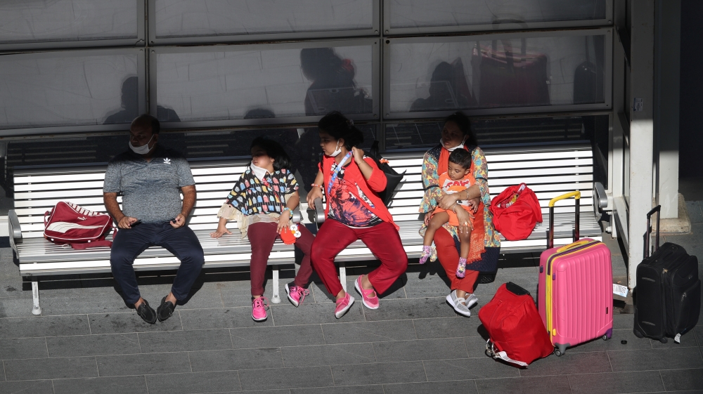 Travelers are seen at Kingsford Smith International Airport in Sydney