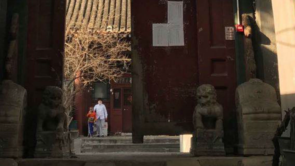 The gate – known as a Chuihuamen – at the Beijing alleyway where Kelly Dawson lives. Temperatures are taken and details recorded each time she arrives home.