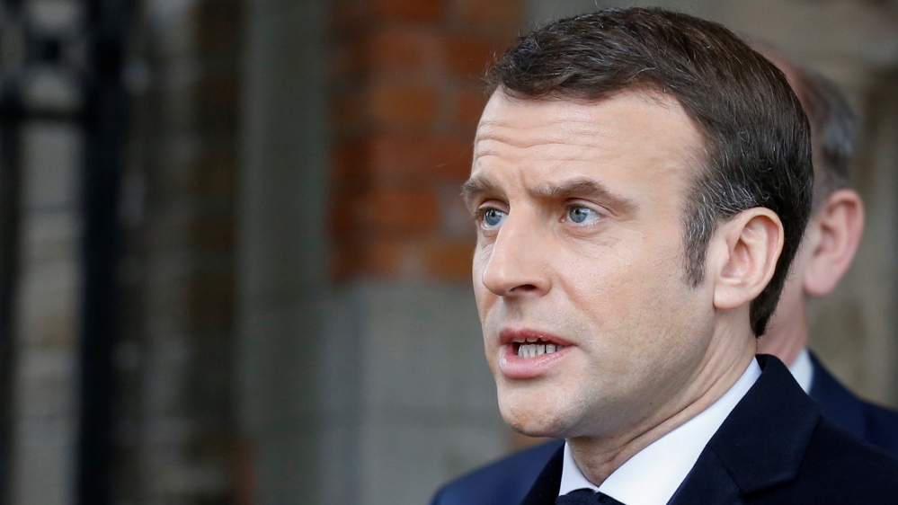 French President Emmanuel Macron speaks to the media, after casting his ballot during the first round of the mayoral elections in Le Touquet