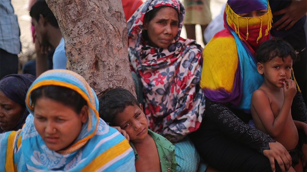 Rohingya women and kids are seen at the make-shift camp after a fire broke out in the early hours of Sunday morning, destroying their refugee camp in Kalindi Kunj area in New Delhi. No loss of life ha