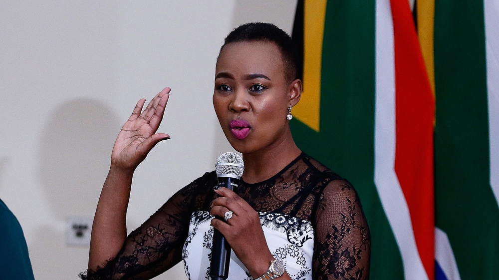 Newly appointed Minister of Communications and Telecommunications Stella Ndabeni-Abrahams (R) is sworn in by Chief Justice Mogoeng Mogoeng at Sefako Makgato Presidential Guesthouse on May 30, 2019 in 