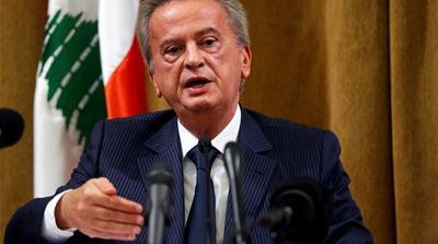 Demonstrators carry Lebanese flag