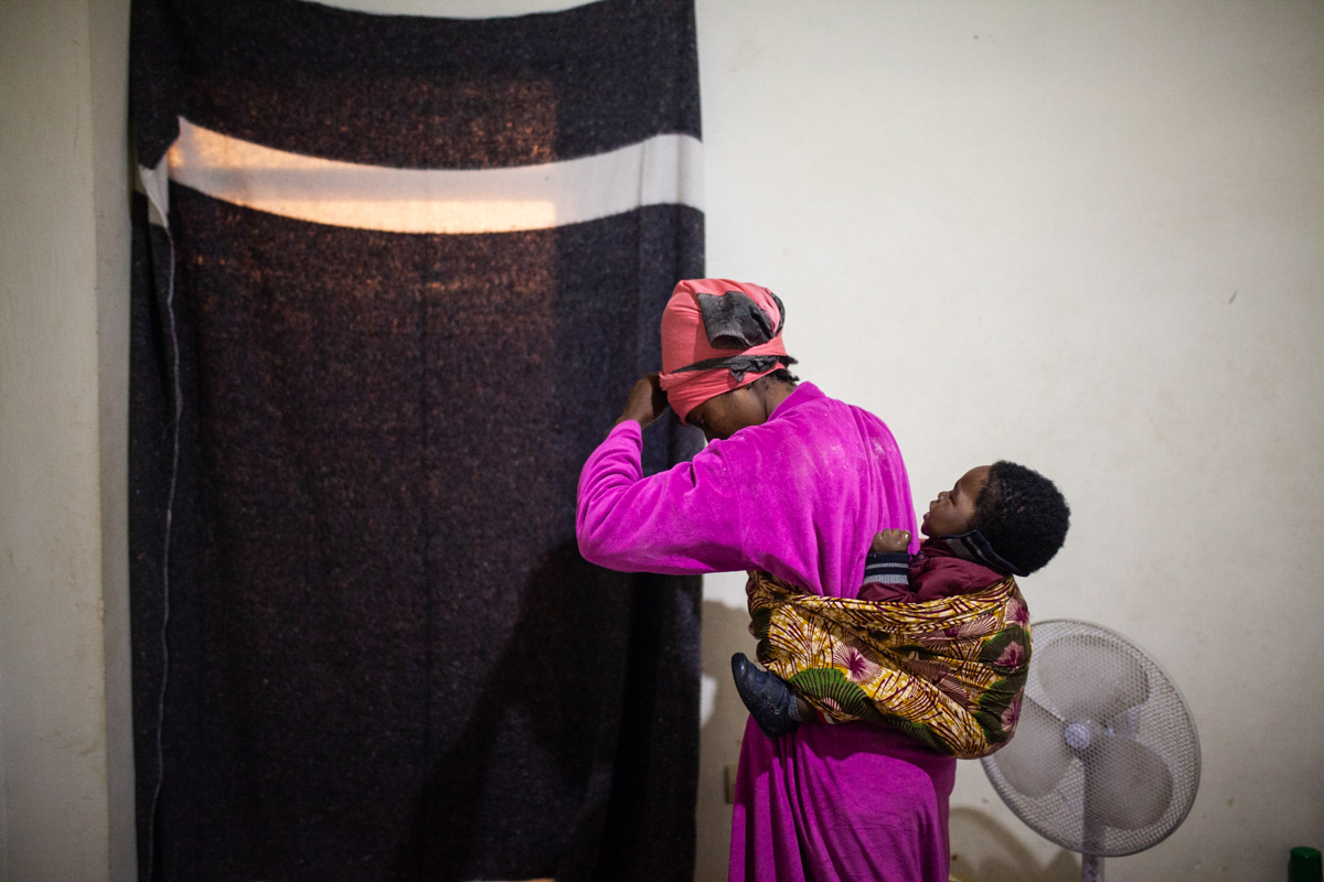 Christelle carries Ivan everywhere, she doesn´t want him to learn to walk since, if he does, he will have to pay for his place in a plastic boat as an adult. With each exit abroad they risk being inte