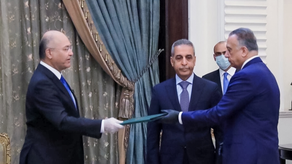 Iraq''s President Barham Salih instrcuts newly appointed Prime Minister Mustafa al-Kadhimi in Baghdad, Iraq April 9, 2020. The Presidency of the Republic of Iraq Office/Handout via REUTERS ATTENTION ED