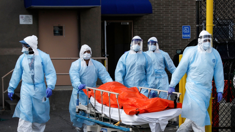 Healthcare workers wheel the body of deceased person from the Wyckoff Heights Medical Center during the outbreak of the coronavirus disease (COVID-19) in the Brooklyn borough of New York City, New Yor