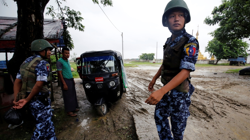 Myanmar police officer stands guard in Maungdaw, Rakhine