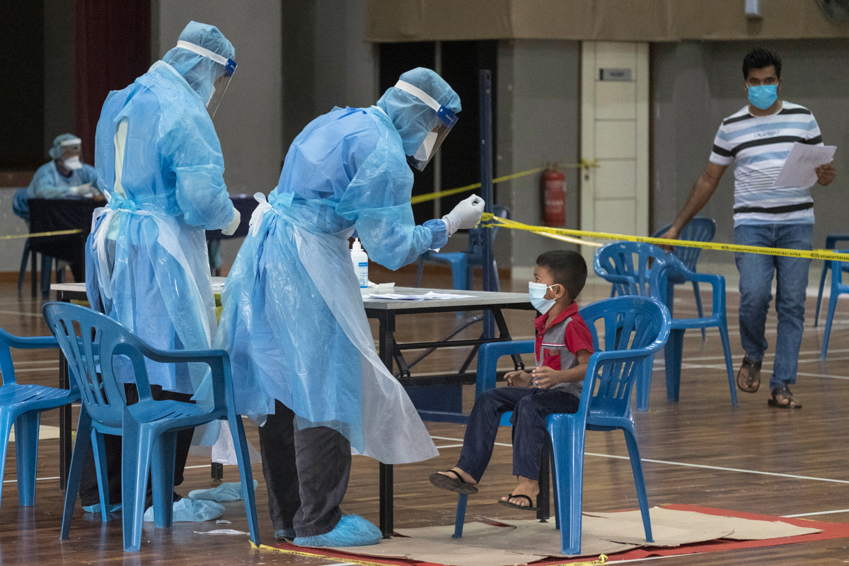 A child is tested for Covid-19 at a temporary testing facility set up by the Malaysian Ministry of Health. “We commend the Government of Malaysia for its inclusive policy of making screening and treat