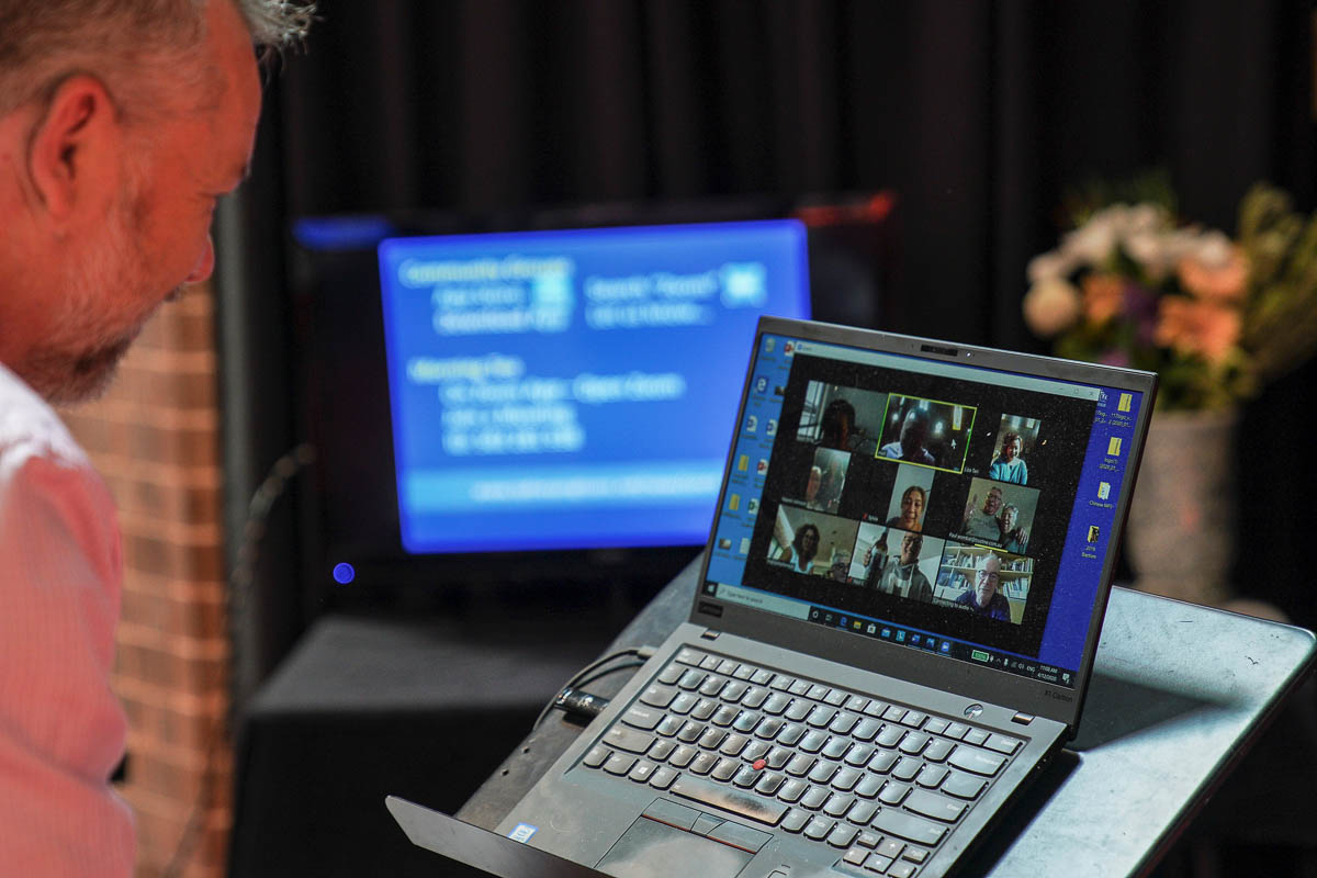 Pastor Matt Johnson interacts with parishioners via Zoom on a laptop upon concluding an Easter service he led which is live-streamed via the internet for the parishioners due to social gathering restr