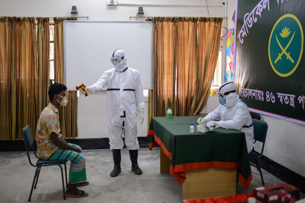 A man who cannot afford to go medical during corona pandemic is getting free medical treatment which is provided by Bangladesh Army at Bangla Bazar area Dhaka. Mahmud Hossain Opu/Al Jazeera