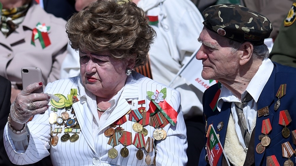 Veterans gather to watch a military parade to mark the 75th anniversary of the Soviet Union's victory over Nazi Germany in World War Two, in Minsk on May 9, 2020. Sergei GAPON / AFP