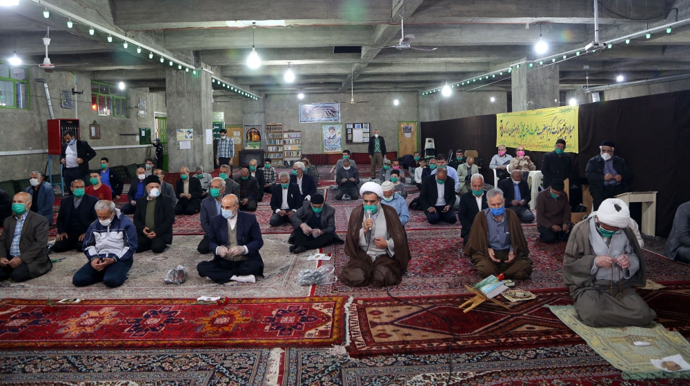Re-opening of mosques to prayers in white regions of Iran- - ABYEK, IRAN - MAY 07: People perform a prayer in accordance with social distancing at Imam Sadiq Mosque after Iranian government announced