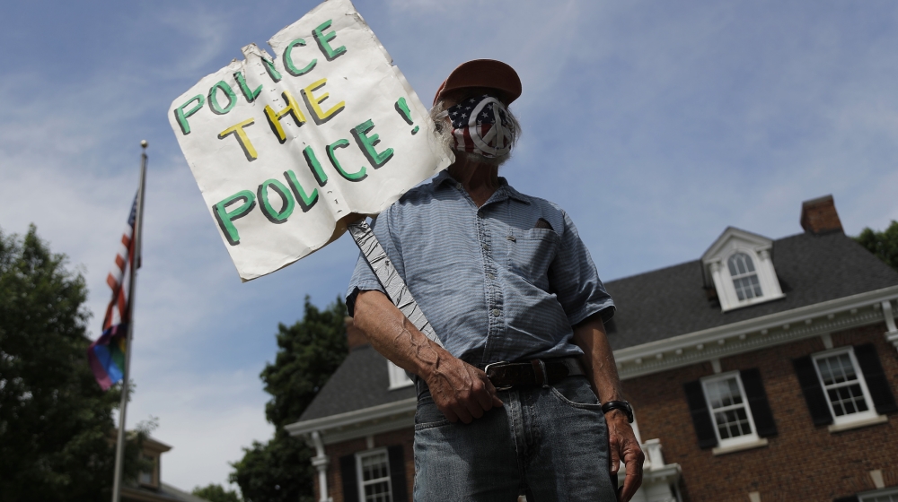 People gather in front of the St. Paul, Minn. governor's mansion on Saturday, June 6, 2020. Protests continue over the death of George Floyd who died after being restrained by Minneapolis police offic
