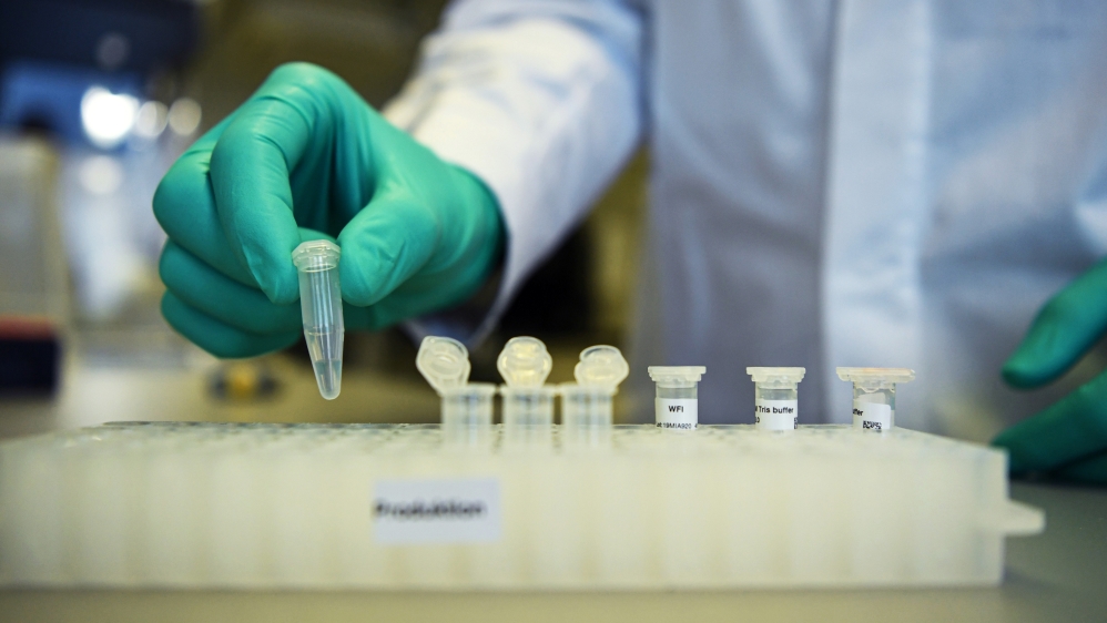 Employee Philipp Hoffmann, of German biopharmaceutical company CureVac, demonstrates research workflow on a vaccine for the coronavirus (COVID-19) disease at a laboratory in Tuebingen