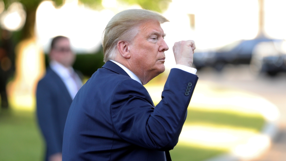 U.S. President Trump thrusts his fist after photo opportunity in front of St John''s Church in Washington