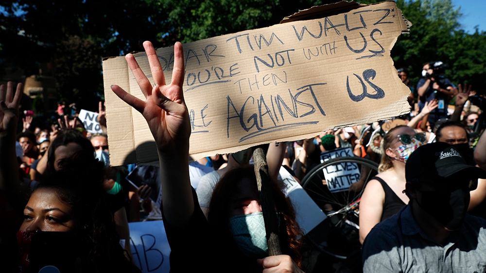 Demonstrators chant demanding the arrest and prosecution of all four police officers involved in the death of George Floyd, Monday, June 1, 2020, at the governor''s mansion in St. Paul, Minn. Protests