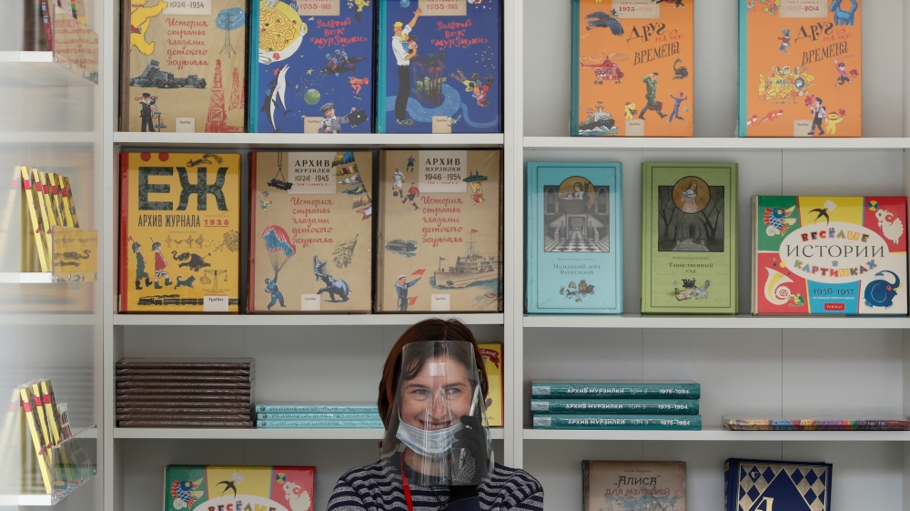 An assistant works at the annual Red Square Book Fair in central Moscow