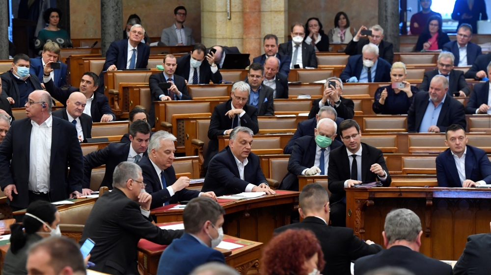 Hungarian Prime Minister Viktor Orban discusses the law granting the government special powers to combat the coronavirus disease (COVID-19) crisis at the Hungarian parliament in Budapest