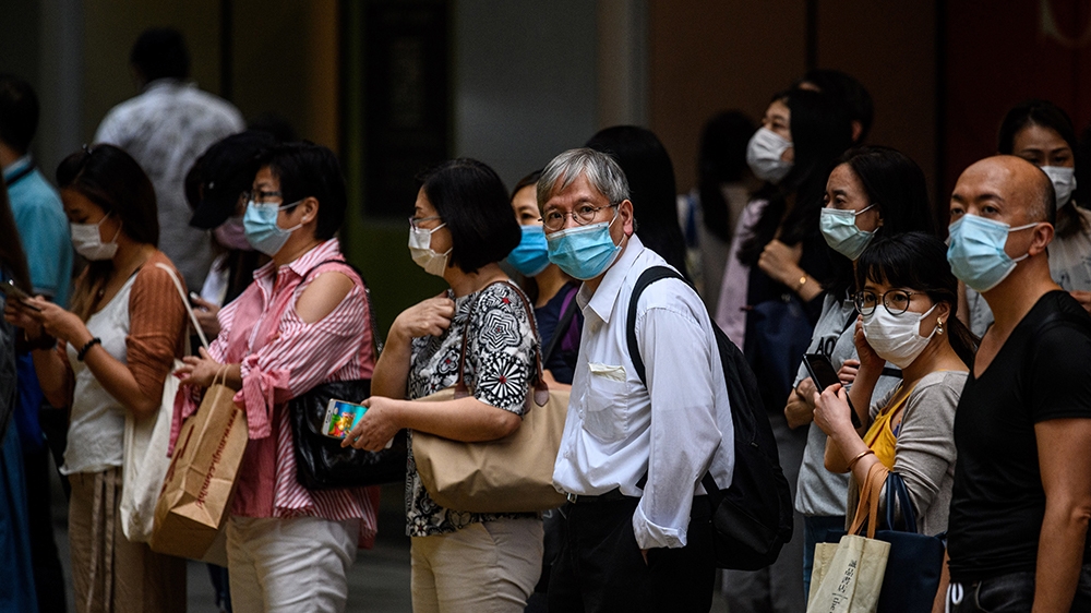 Since late January, the global financial hub has reported more than 1,500 cases and eight deaths [AFP]