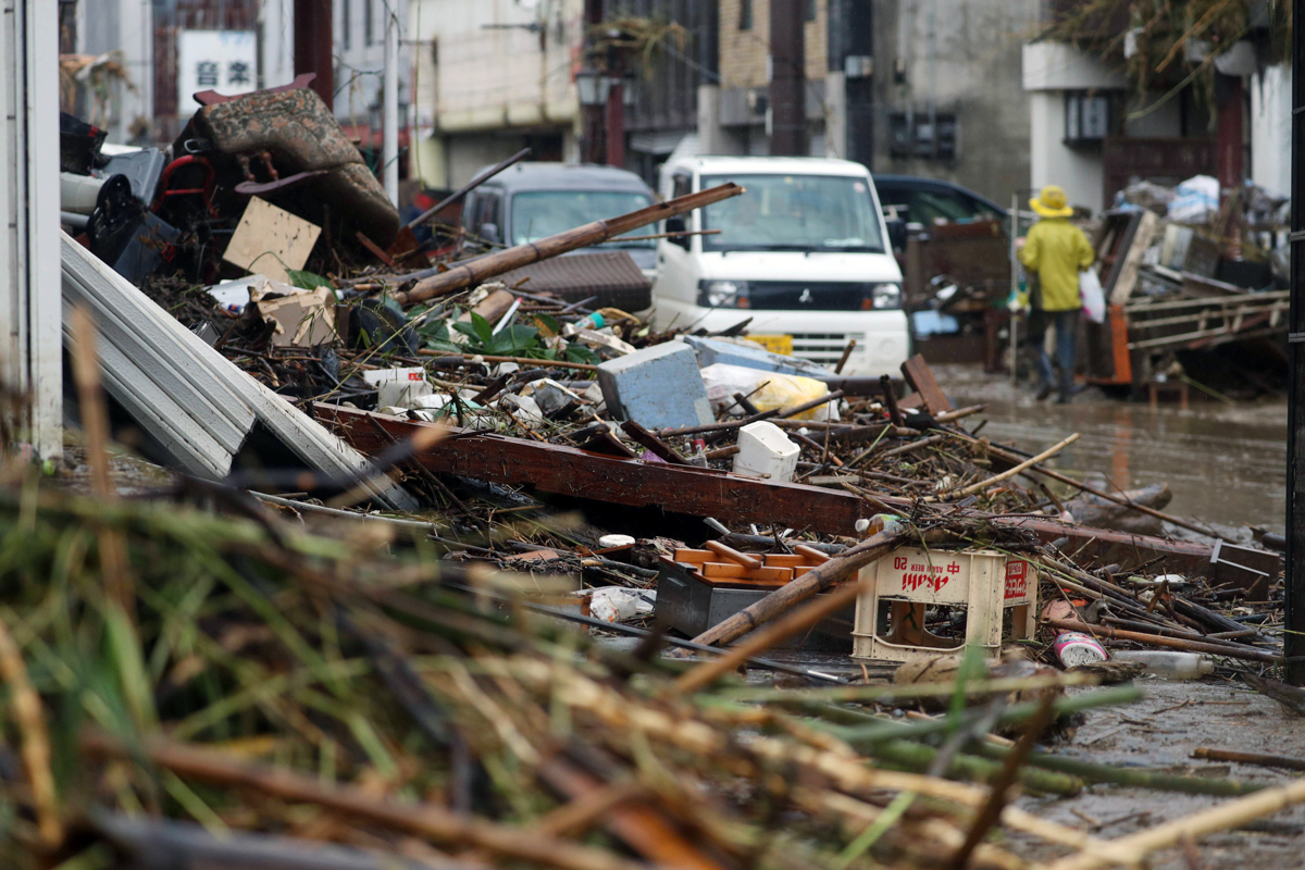 epa08528927 A street is covered with mud and debris in Hitoyoshi, Kumamoto prefecture, southwestern Japan, 05 July 2020. According to latest madia reports, more than 30 people are feared to have died
