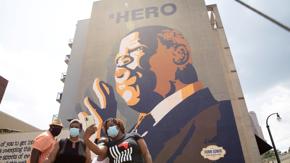 Mourners view a makeshift memorial to the passing of the late Rep. John Lewis in Atlanta