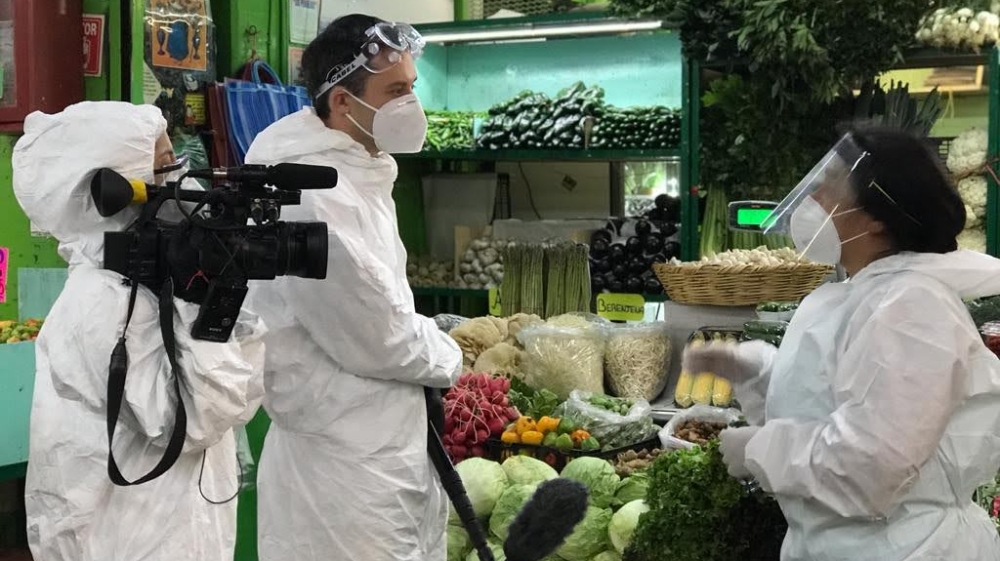 Vanessa Gomez and John Holman filming in Central de Abasto, Mexico’s biggest food market