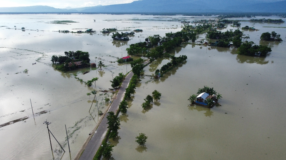 BANGLADESH-INDIA-NEPAL-WEATHER-FLOOD  In this aerial photo inundated houses are seen in Sunamgong on July 14, 2020. Almost four million people have been hit by monsoon floods in South Asia
