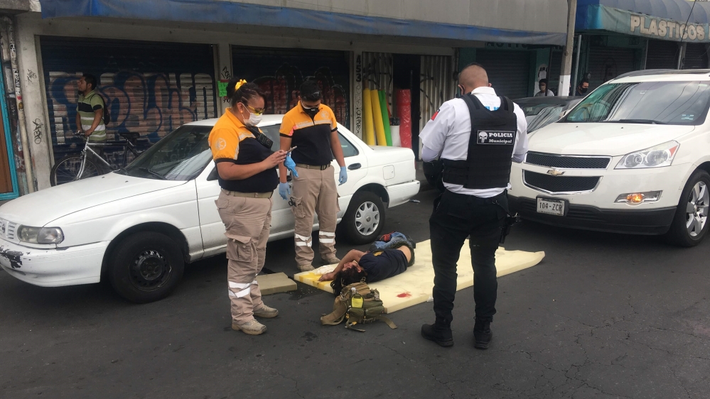 Paramedics Mydori and Sergio dealing with car crash victim