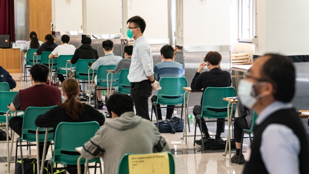 Temperature checks and social distancing measures to avoid the spread of COVID-19 had been put in place in schools across Hong Kong