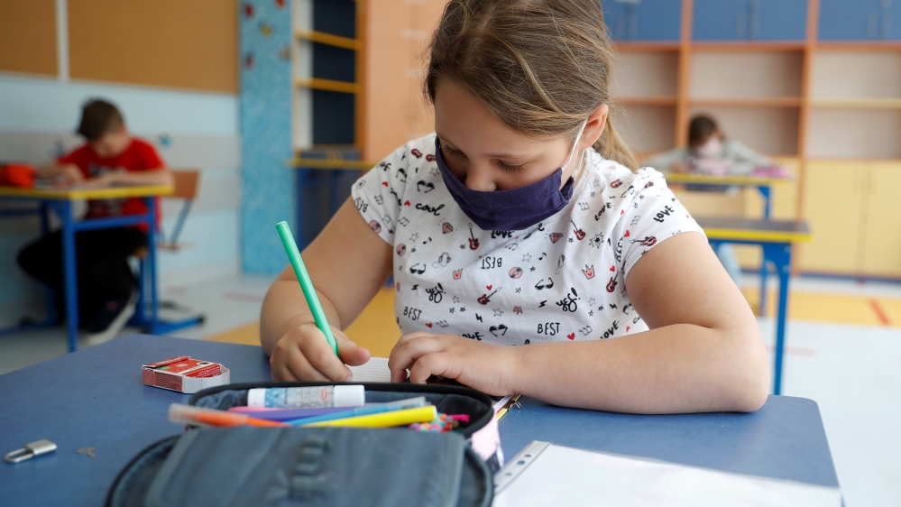 Girl takes lesson after some classes reopened in Warsaw
