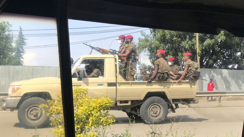 Ethiopian military ride on their pick-up truck as they patrol the streets following protests in Addis Ababa, Ethiopia July 2, 2020. REUTERS/Tiksa Negeri